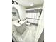 Clean bathroom with gray vanity, black and white striped shower curtain at 14596 Toponas Pl, Fishers, IN 46040