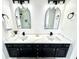 Stylish bathroom with double sink vanity, modern light fixtures and a glass shower at 14596 Toponas Pl, Fishers, IN 46040