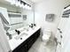 Bathroom featuring dual sinks, marble tile floors, and a black and white shower curtain at 14596 Toponas Pl, Fishers, IN 46040