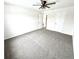 A spacious bedroom offers neutral carpet, a ceiling fan, and ample closet space at 14596 Toponas Pl, Fishers, IN 46040