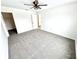 A spacious bedroom offers neutral carpet, a ceiling fan, and ample closet space at 14596 Toponas Pl, Fishers, IN 46040