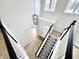 Bright foyer features high ceilings, pendant lighting, and staircase with decorative stair runner at 14596 Toponas Pl, Fishers, IN 46040
