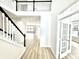 Bright foyer with hardwood floors, a staircase, and French doors leading to a room at 14596 Toponas Pl, Fishers, IN 46040