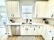 Kitchen with white cabinets, stainless steel appliances, and a window above the sink at 14596 Toponas Pl, Fishers, IN 46040