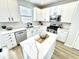 Clean kitchen with white cabinets, stainless steel appliances, and a quartz countertop island at 14596 Toponas Pl, Fishers, IN 46040