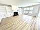 Spacious living room features a fireplace, custom built-ins, and large windows that provide ample natural light at 14596 Toponas Pl, Fishers, IN 46040