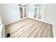 Bright living room featuring stylish french doors and beautiful floors that offer an open and inviting atmosphere at 14596 Toponas Pl, Fishers, IN 46040