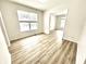 Bright living room featuring an open plan, large window and beautiful floors that offer an open and inviting atmosphere at 14596 Toponas Pl, Fishers, IN 46040