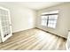 Bright room with hardwood floors and a large window with blinds at 14596 Toponas Pl, Fishers, IN 46040