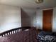 Bedroom features a bed and sloped ceilings, with an open doorway at 1524 S K St, Elwood, IN 46036