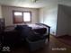 Bedroom features a bed and sloped ceilings at 1524 S K St, Elwood, IN 46036