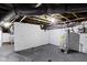 Unfinished basement with painted walls, utility systems, and concrete floor at 17 Parkview Ave, Indianapolis, IN 46201