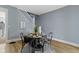 Cozy dining room featuring modern decor, stylish furniture and a staircase in the background at 17 Parkview Ave, Indianapolis, IN 46201