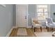 Bright entryway featuring a white door, light blue walls, and two armchairs at 17 Parkview Ave, Indianapolis, IN 46201