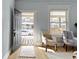 Cozy entryway with light blue walls, hardwood floors, and natural light at 17 Parkview Ave, Indianapolis, IN 46201