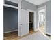 Hallway connecting rooms with an entrance to a bathroom, natural lighting, and wood flooring at 17 Parkview Ave, Indianapolis, IN 46201