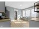 Bright kitchen featuring wood floors, stainless steel appliances, and a cozy dining space at 17 Parkview Ave, Indianapolis, IN 46201
