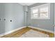 The laundry room includes wood floors, fresh paint, and a large window providing ample sunlight at 17 Parkview Ave, Indianapolis, IN 46201
