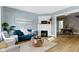 Stylish living room with hardwood floors, fireplace, and comfortable blue sofa at 17 Parkview Ave, Indianapolis, IN 46201