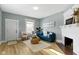 Inviting living room with a fireplace, blue sofa, and a cozy area rug at 17 Parkview Ave, Indianapolis, IN 46201