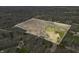 Expansive aerial view of the property showcasing the diverse landscape and outlined boundaries at 1828 W 750 S, Trafalgar, IN 46181