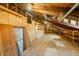Spacious unfinished attic with exposed wooden beams and built in shelving is ready for a new design at 1828 W 750 S, Trafalgar, IN 46181