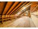 Spacious unfinished attic with exposed wooden beams and built in shelving, ready for a new design at 1828 W 750 S, Trafalgar, IN 46181