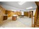 Large finished basement with a pool table, kitchenette, wood paneled walls, and access to an exterior stairwell at 1828 W 750 S, Trafalgar, IN 46181