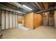 Spacious unfinished basement with bare walls, concrete floor, and partial enclosure at 1828 W 750 S, Trafalgar, IN 46181