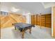 Finished basement with pool table with wood paneled walls and carpeted floor at 1828 W 750 S, Trafalgar, IN 46181