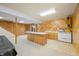 Finished basement includes a kitchenette with an adjacent stairwell and view to the backyard at 1828 W 750 S, Trafalgar, IN 46181