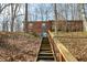 View of the basement entrance featuring a staircase, a small window and a sliding door at 1828 W 750 S, Trafalgar, IN 46181
