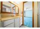 Bright bathroom featuring a white vanity and a doorway leading to the bedroom at 1828 W 750 S, Trafalgar, IN 46181