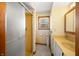Bathroom with shower, window, and vanity at 1828 W 750 S, Trafalgar, IN 46181