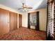 Bedroom with closet, ceiling fan, and natural light, offering practical storage and a comfortable, airy ambiance at 1828 W 750 S, Trafalgar, IN 46181