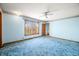 A light blue bedroom features plush carpeting and a ceiling fan at 1828 W 750 S, Trafalgar, IN 46181