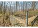 This scenic shot captures a bridge spanning a creek in a wooded area at 1828 W 750 S, Trafalgar, IN 46181