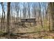 Distant view of a covered bridge surrounded by trees and foliage in a natural landscape at 1828 W 750 S, Trafalgar, IN 46181