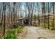 Exterior shot of covered bridge surrounded by trees and spring flowers in a natural setting at 1828 W 750 S, Trafalgar, IN 46181