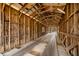 Inside view of a covered bridge, revealing wooden beams and aged structure, offering a rustic charm at 1828 W 750 S, Trafalgar, IN 46181