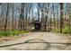 Covered bridge on a sunny day bordered by trees and daffodils in a scenic environment at 1828 W 750 S, Trafalgar, IN 46181