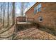 Wooden deck with steps overlooking a wooded area, attached to a red brick house at 1828 W 750 S, Trafalgar, IN 46181