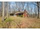 Two-story home featuring a brick chimney, screened porch and mature trees at 1828 W 750 S, Trafalgar, IN 46181