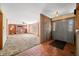 Inviting home foyer with vintage tile floors, wood paneling, and a view of the spacious living room with fireplace at 1828 W 750 S, Trafalgar, IN 46181