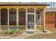 Charming front porch with a screen door and view of the landscaped front yard at 1828 W 750 S, Trafalgar, IN 46181