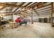 Inside of large outbuilding with a red truck and ample storage and working space at 1828 W 750 S, Trafalgar, IN 46181