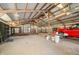 The spacious interior of the outbuilding includes storage and a red truck at 1828 W 750 S, Trafalgar, IN 46181