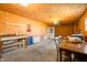 Attached garage space with plywood walls, lighting, and garage door at 1828 W 750 S, Trafalgar, IN 46181