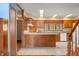Kitchen featuring light granite countertops, tile floors, and wooden cabinets at 1828 W 750 S, Trafalgar, IN 46181