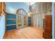 Living Room showcasing hardwood floors, natural light, and a rustic wooden cabinet at 1828 W 750 S, Trafalgar, IN 46181